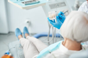 View of a elderly lady in dental surgeons chair stock photo